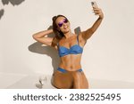 Summertime Snapshot: Bikini Babe Captures Poolside Moment