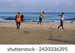 Small photo of Cartagena, Bolivar Colombia - 1 February 2024: Stories of Sea and Work: Cartagena fishermen. The fishermen pull on their shoulders the line of the trammel net for the harvesting of the catch.
