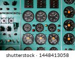 background of control panel in the cockpit. lights, analog gauges, and buttons in the dashboard panel of the old aircraft. 