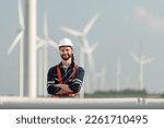 Small photo of Engineer at Natural Energy Wind Turbine site with a mission to climb up to the wind turbine blades to inspect the operation of large wind turbines that converts wind energy into electrical energy