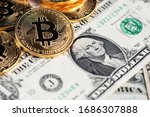 Background with Bitcoin cryptocurrency coins on one US Dollar. Virtual cryptocurrency concept. Bitcoin BTC cryptocurrency coins and banknotes of one US Dollar. BTC vs USD  