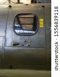Small photo of Side door marked `jettison` on a Belvedere helicopter. Many rivets hold the metal plates together.
