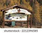 Small photo of Dawson City, Yukon Territory Canada - September 12th 2022: Information board near Bonanza Creek where the Klondike Gold Rush started.