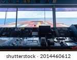 View of the control console on the navigational bridge of the cargo container ship. 