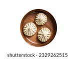 Small photo of Boiled Khinkali Dumplings with mutton lamb meat in wooden plate. High quality Isolate, white background.