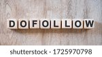 Small photo of Dofollow links - text on small wooden cubes on a natural table