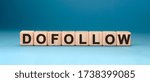 Small photo of Dofollow - text concept on wooden cubes with gradient blue background