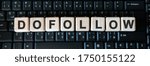 Small photo of Dofollow web link - business concept text on wooden cubes on background black keyboard