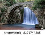 An old stone bridge and a beautiful waterfall at Paleokaria, Trikala, Greece