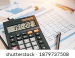 Small photo of vat word and 2021 number on a calculator. Business and tax concept.Value Added Tax. The new year 2021 tax concept