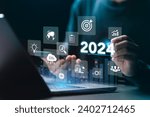 Small photo of Businessman plan strategy marketing and finance to goal in 2024 planning business growth with technology AI and environmental care to New Year resolutions business. digital transformation 2024