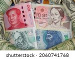 Banknotes of 100 yuan, 500 and 100 czech crown, 50 zloty with US dollar edging