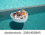 Small photo of Breakfast in swimming pool, floating breakfast in heart tray tropical resort. Table relaxing in calm pool water, healthy breakfast and fruit plate by resort pool in Maldives