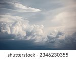 Small photo of Dramatic, dark, blue cloudy sky overlay, Sky-overlays. Dramatic sky and lightning. Bad weather with dark clouds. Rain And Thunderstorm In Dramatic Sky