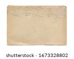 rear view closeup of blank old aged open letter paper envelope with torn edges and faded postage stamp print isolated on white background