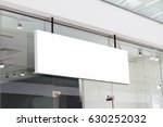 horizontal white empty signage on clothes shop front with glass windows 
