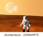 Astronaut spaceman planet Mars surface space. Elements of this image furnished by NASA.