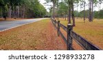 Fence Bordering Low Country Road