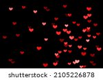 Bokeh red lights isolated on black background. Heart-shaped, love concept, Valentine's Day, February 14