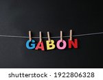 Small photo of Word Gabon on black background. Gabon officially the Gabonese Republic, is a country on the west coast of Central Africa.