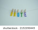 Small photo of Word 'Brute' on white background. Brute define as an animal as opposed to a human being or a savagely violent person or animal.