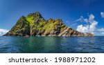 Large panorama with cruise boats docking to Skellig Michael island, where Star Wars were filmed, UNESCO World Heritage, Ring of Kerry, Ireland