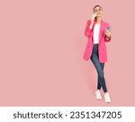 Small photo of Dreamful wistful woman, full body view young caucasian dreamful wistful woman. Holding credit bank card and mobile smartphone, look aside. Copy space, workspace banner advertising design concept.