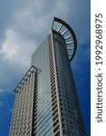 Small photo of FRANKFURT, GERMANY - Jun 10, 2021: Westend 1 is the second tower of DZ Bank, the central institution of the cooperative banks An impressive architecture against a restless sky