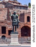 Small photo of A vertical shot of the statue of emperor Traian in Rome, Italy
