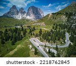 An aerial view of curving roads at Sella Pass in the Dolomites Mountain in Italy