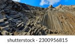Small photo of A low angle panoramic shot of prismatic disjunction in Porto Santo island in Madeira