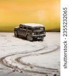 Small photo of MANAMA, BH - Aug 30, 2021: A closeup of a Hummer toy car drifting on fake snow