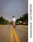 Small photo of EVERETT, US - Jun 08, 2022: A vertical shot of a man riding a one wheel in Everett, United States