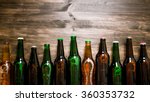 Beer Bottles On A Wooden Table ....