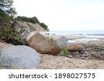 Large Stones On A Sandy Beach...
