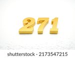 Small photo of Number 271 is made of gold-plated teak, 1 cm thick, laid on a white painted aerated brick floor, giving good 3D visibility.