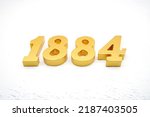    Number 1884 is made of gold painted teak, 1 cm thick, laid on a white painted aerated brick floor, visualized in 3D.                                       