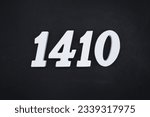 Black for the background. The number 1410 is made of white painted wood.