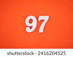 Small photo of Orange felt is the background. The numbers 97 are made from white painted wood.