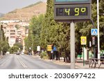 Small photo of Street thermometer in summer marking 49 degrees celsius