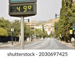 Small photo of Street thermometer in summer marking 49 degrees celsius