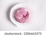 Small photo of tasty homemade zephyr marshmallows with blackberries taste inside whisk wires or in fork,black gray tiles background,kitchen towel.tea in cup and kettle,marshmallow on plate.close up texture macro