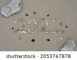 2022 lined with pebbles on the... | Shutterstock . vector #2053767878