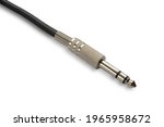 6.5mm stereo audio jack with black cable close-up isolate diagonal position in frame