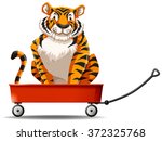 tiger sitting on the red wagon... | Shutterstock .eps vector #372325768