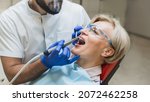Small photo of Male orthodontist checkup. Perfect ideal healthy smile. Stomatological dental equipment, dentist whitening filling tooth teeth of female patient at dental hospital