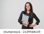 Female young businesswoman auditor inspector examiner controller in formal wear writing on clipboard, checking the quality of goods and service looking at camera isolated in white background
