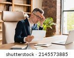 Overload in office. Business problems, debt, credit loan bankruptcy. Caucasian mature middle-aged businessman freelancer ceo boss lawyer receive sad news, bills, fired, mortgage divorce issues