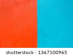 Small photo of half orange half turquoise blue painted concrete or cement stipple wall with imperfections on exterior wall of building for use as background, texture, wallpaper or abstract