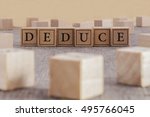 Small photo of DEDUCE word written on building blocks concept